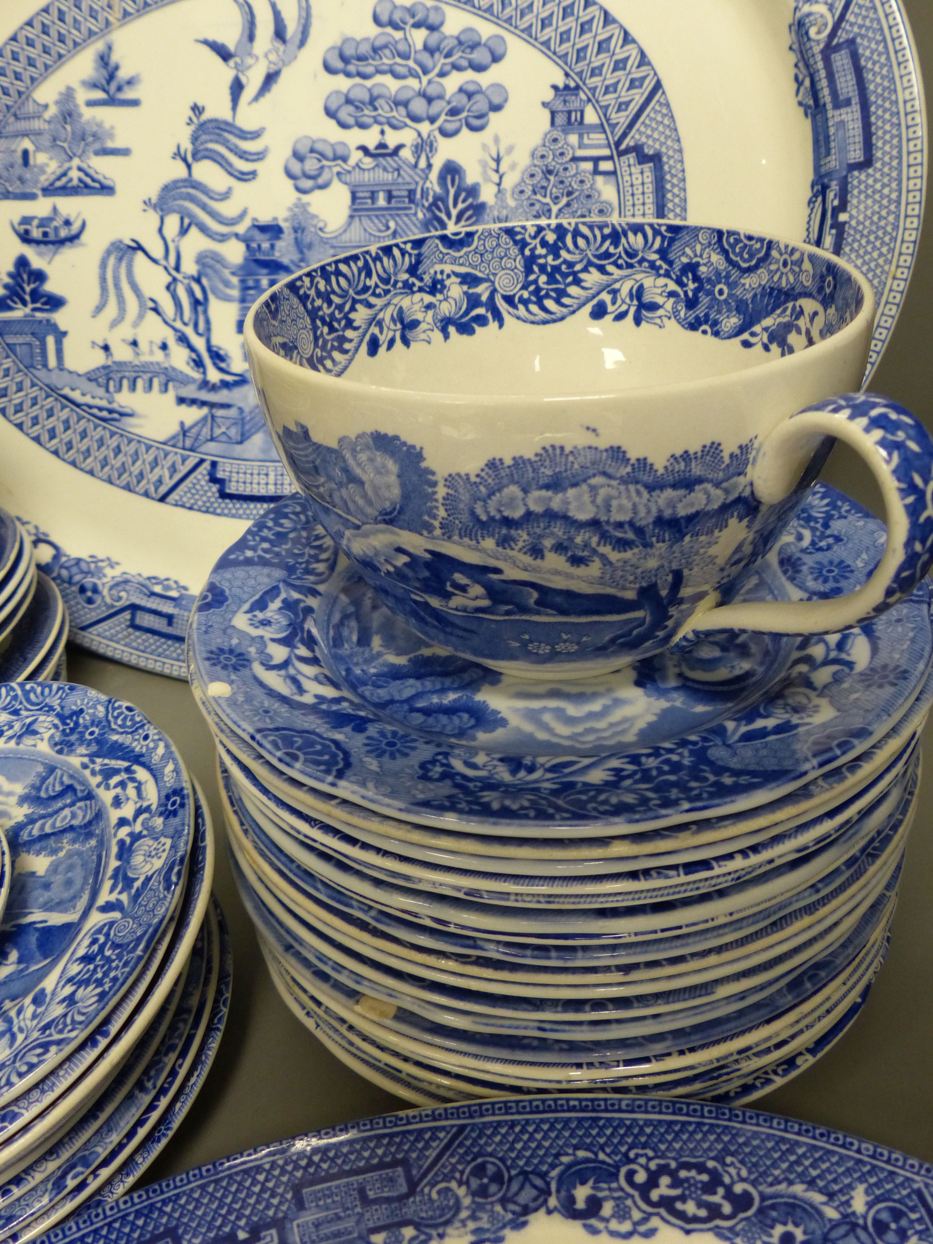 A quantity of blue and white ceramics including Copeland Spodes Italian and Willow pattern